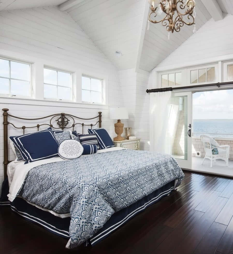 Relaxing Beach Daybed Overlooking The Serene Ocean Wallpaper