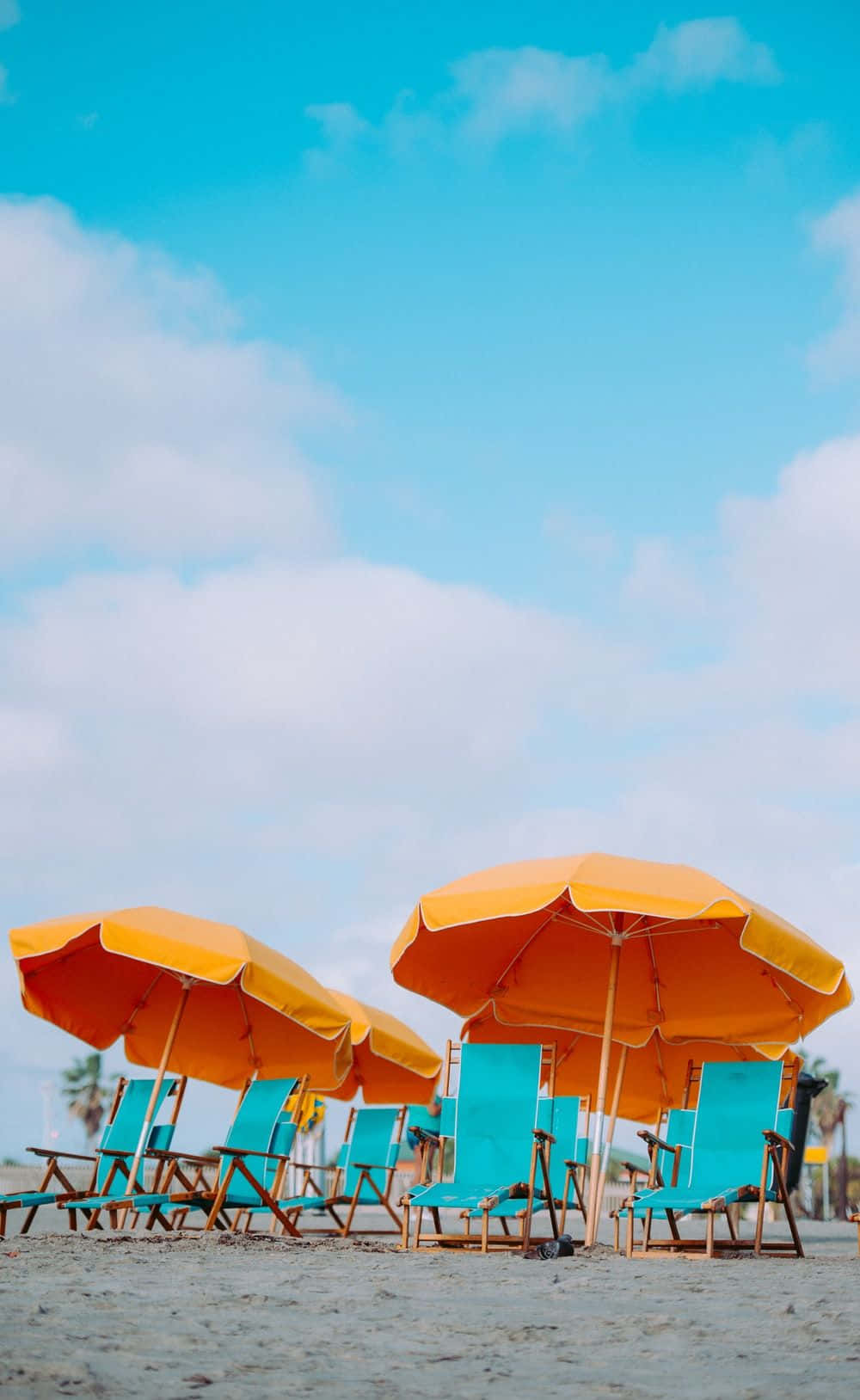 Relaxing Beach Scene With Colorful Umbrella Wallpaper