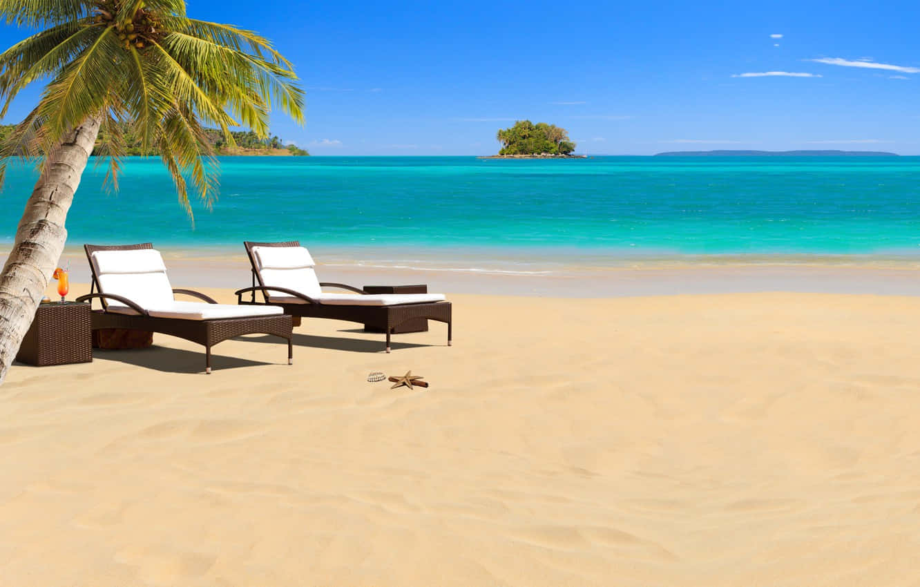 Relaxing Beach Sunbeds By The Shore Wallpaper