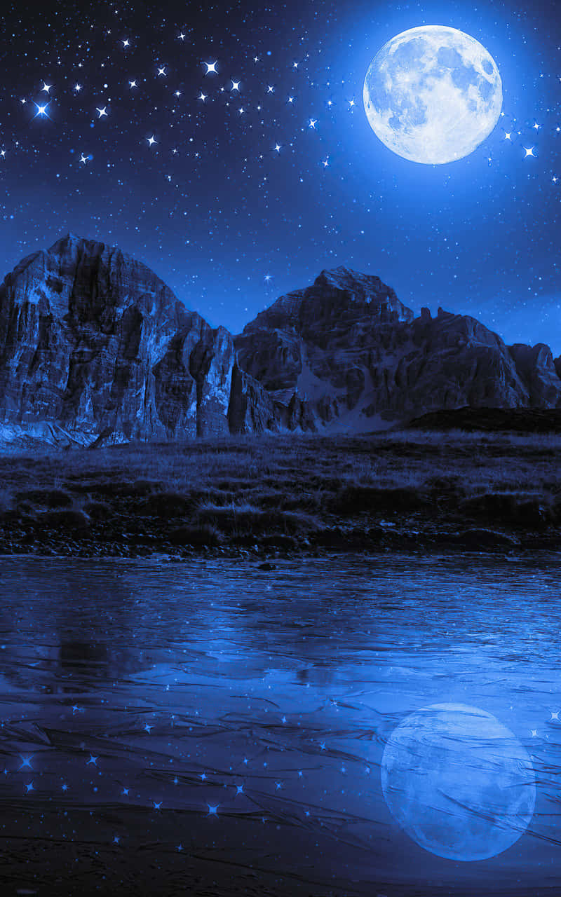 Relish The Mystical Magic Of A Perfect Moonlit Night Wallpaper