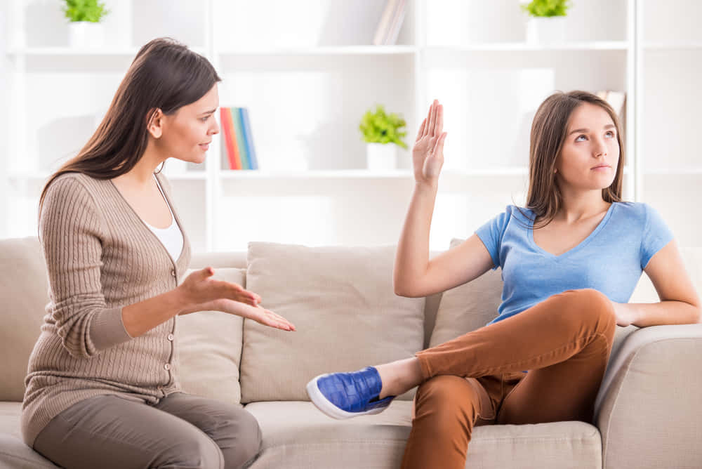 Reluctant Girl Blocking Woman From Talking Wallpaper