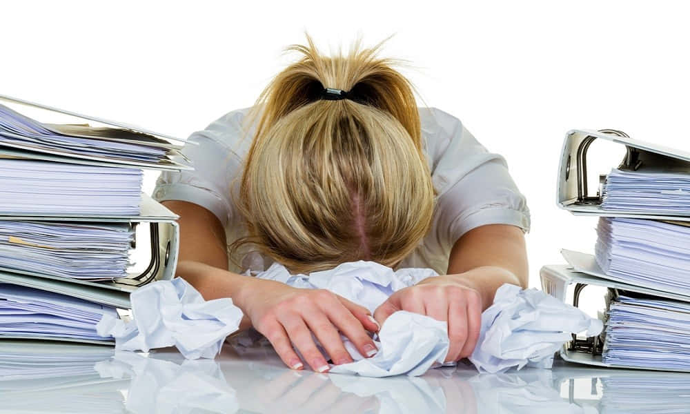 Reluctant Woman With Paperwork Wallpaper