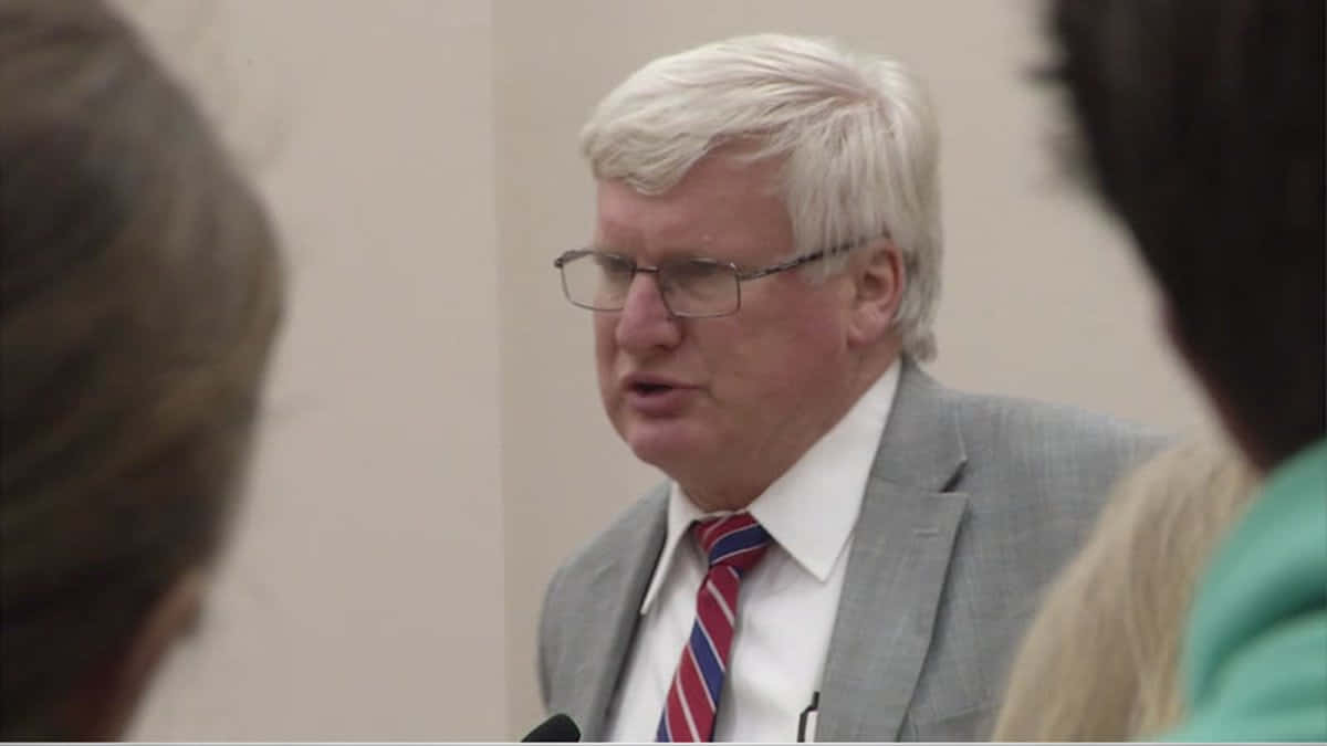 Representative Glenn Grothman At A Press Conference Wallpaper