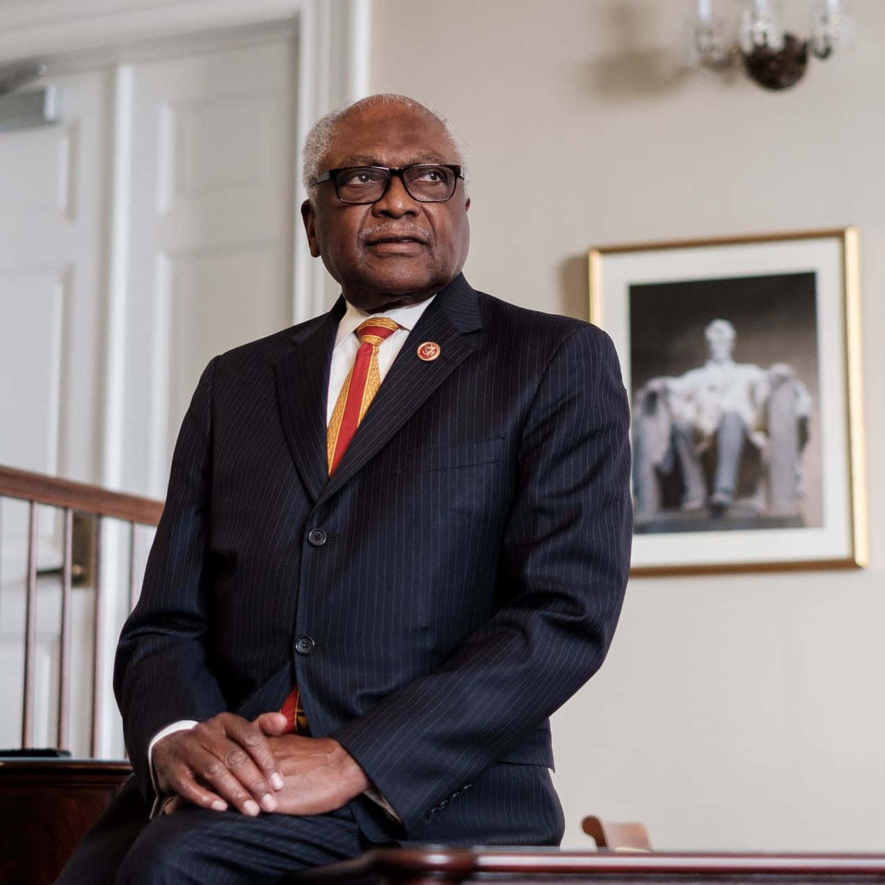 Representative Jim Clyburn Sitting At His Desk Wallpaper