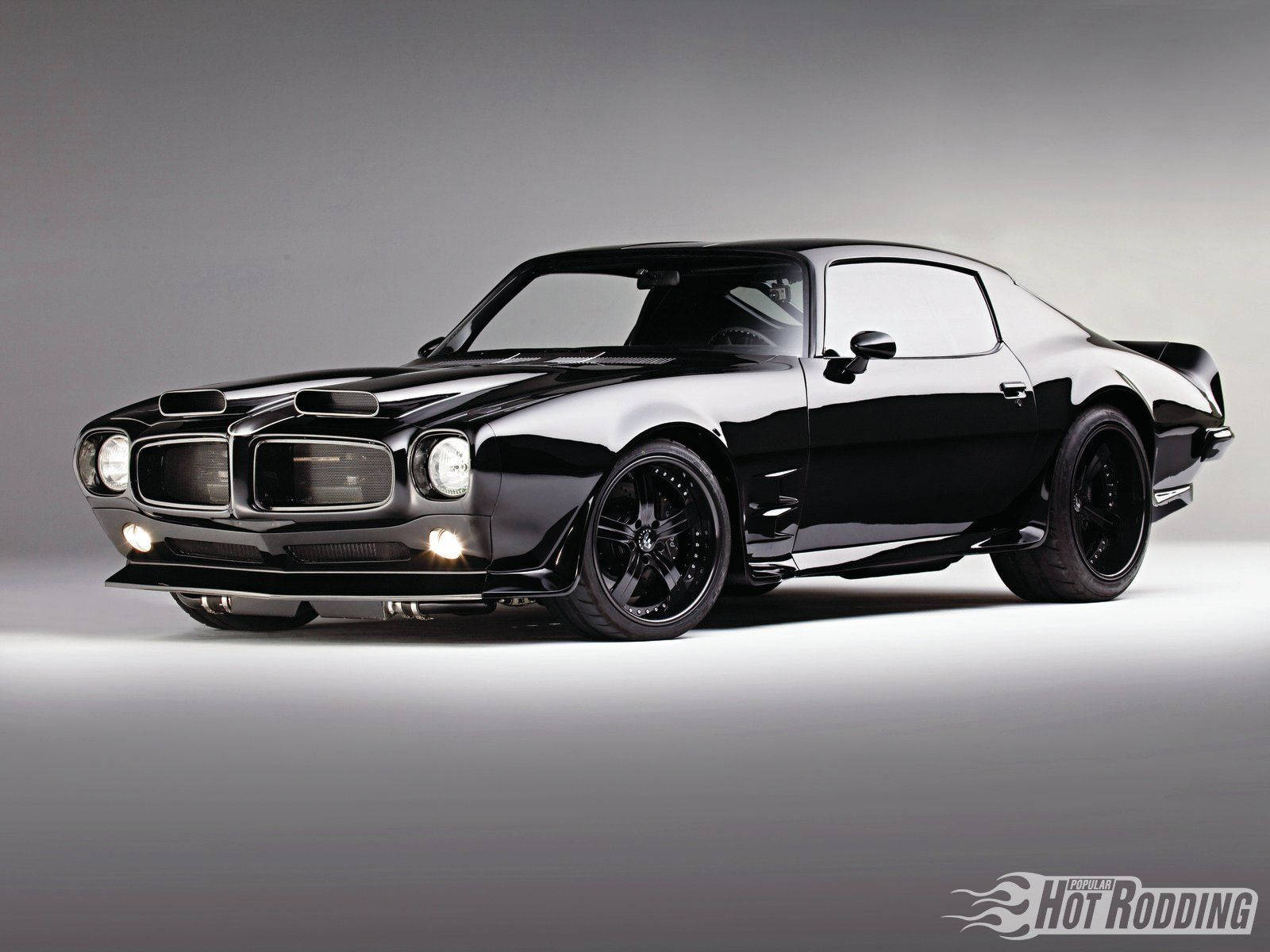 Revving Up The Classic - Pontiac Firebird Muscle Car Wallpaper