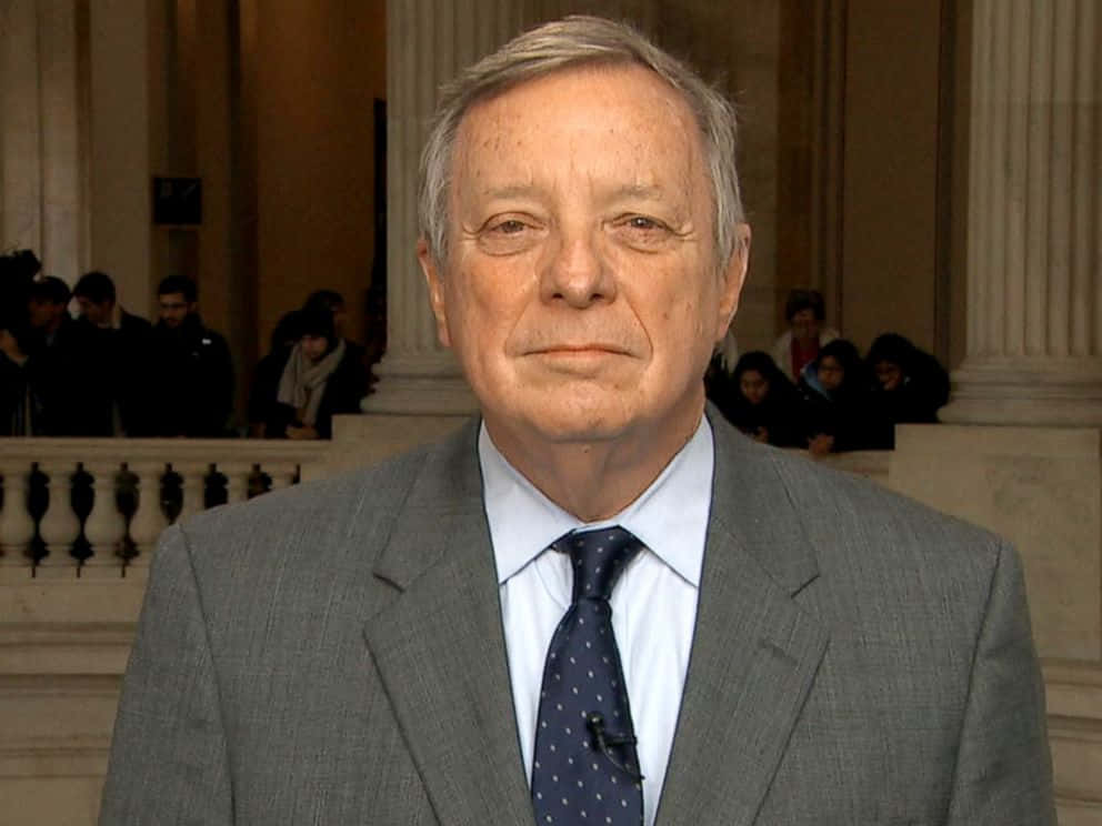 Richard Durbin Smiling At A Conference Wallpaper