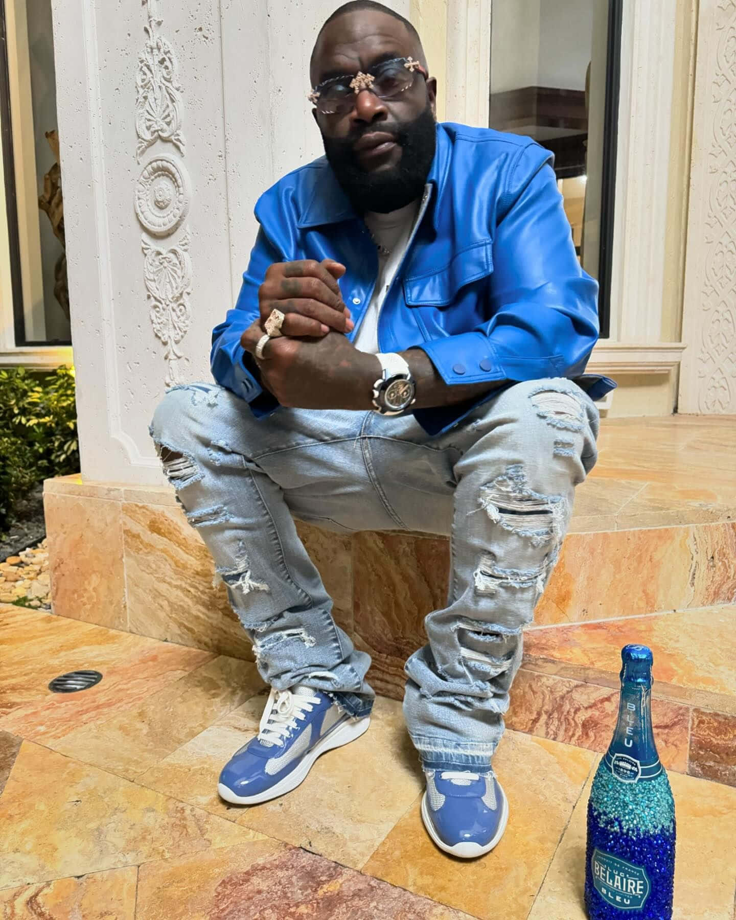 Rick Ross Blue Jacketand Sneakers Wallpaper