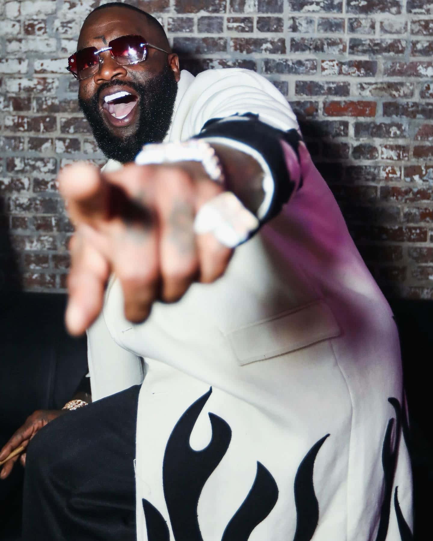 Rick Ross Reaching Out Event Wallpaper