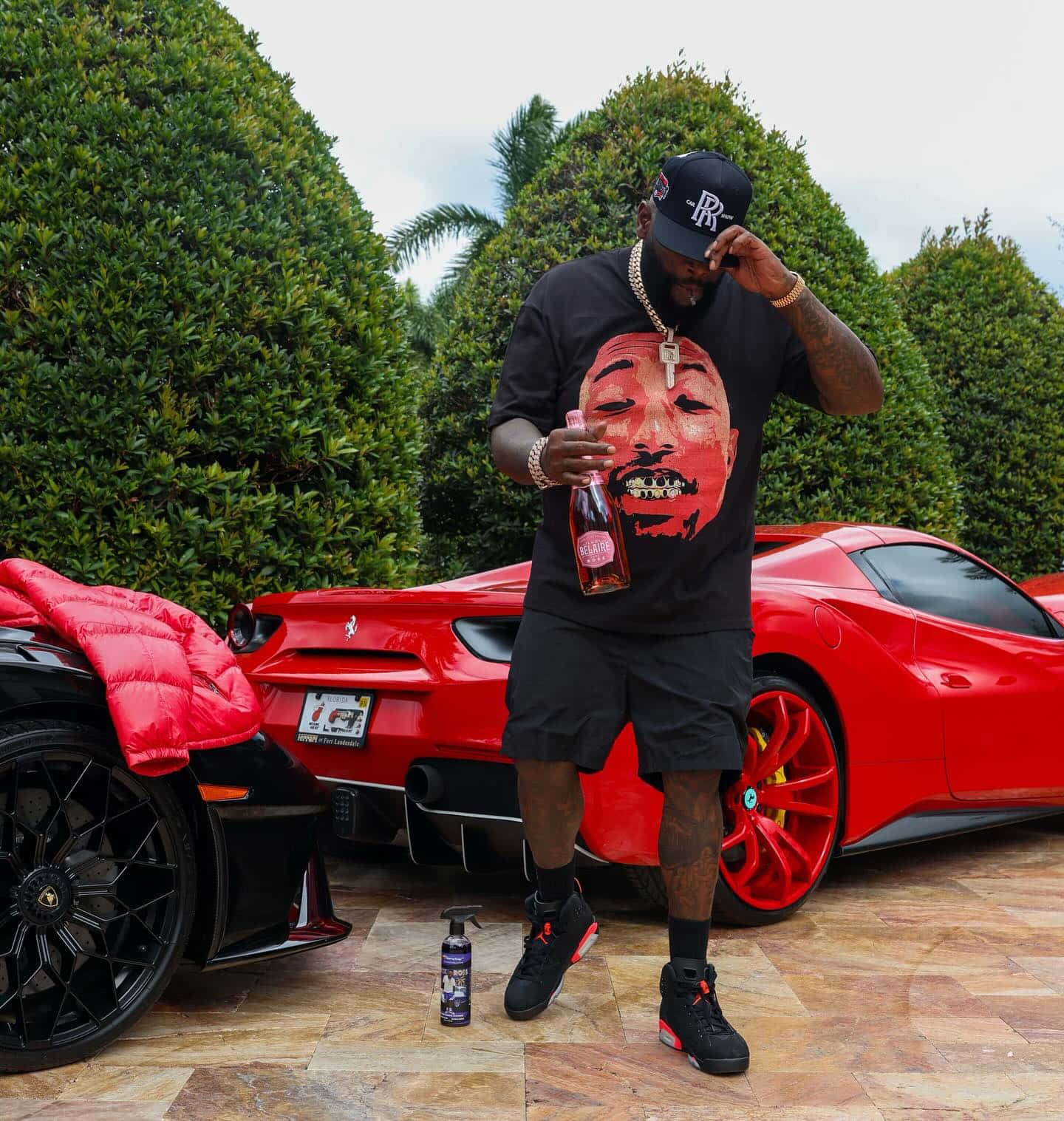 Rick Ross With Luxury Carsand Beverage Wallpaper