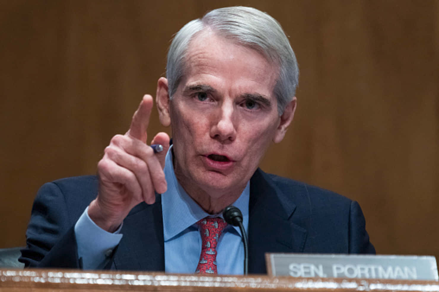 Rob Portman Expressively Gesturing During A Discussion Wallpaper