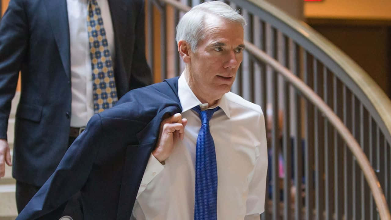 Rob Portman Holding Blazer Wallpaper