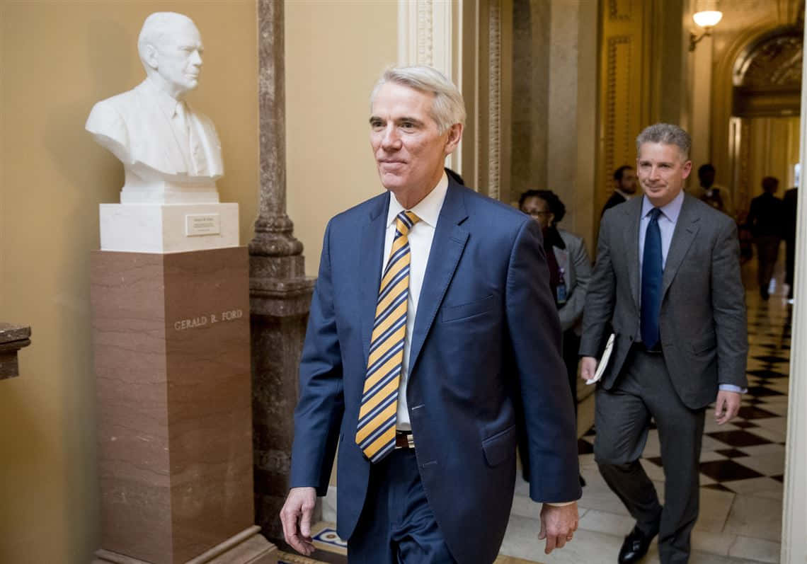 Rob Portman Walking In Hallway Wallpaper