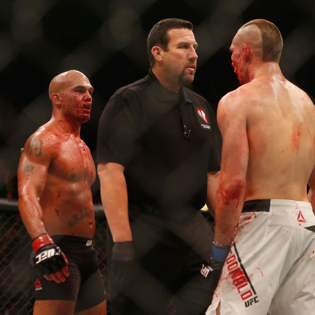 Robbie Lawler Standing Victorious Against Rory Macdonald Post Their Intense Match At Ufc 189. Wallpaper