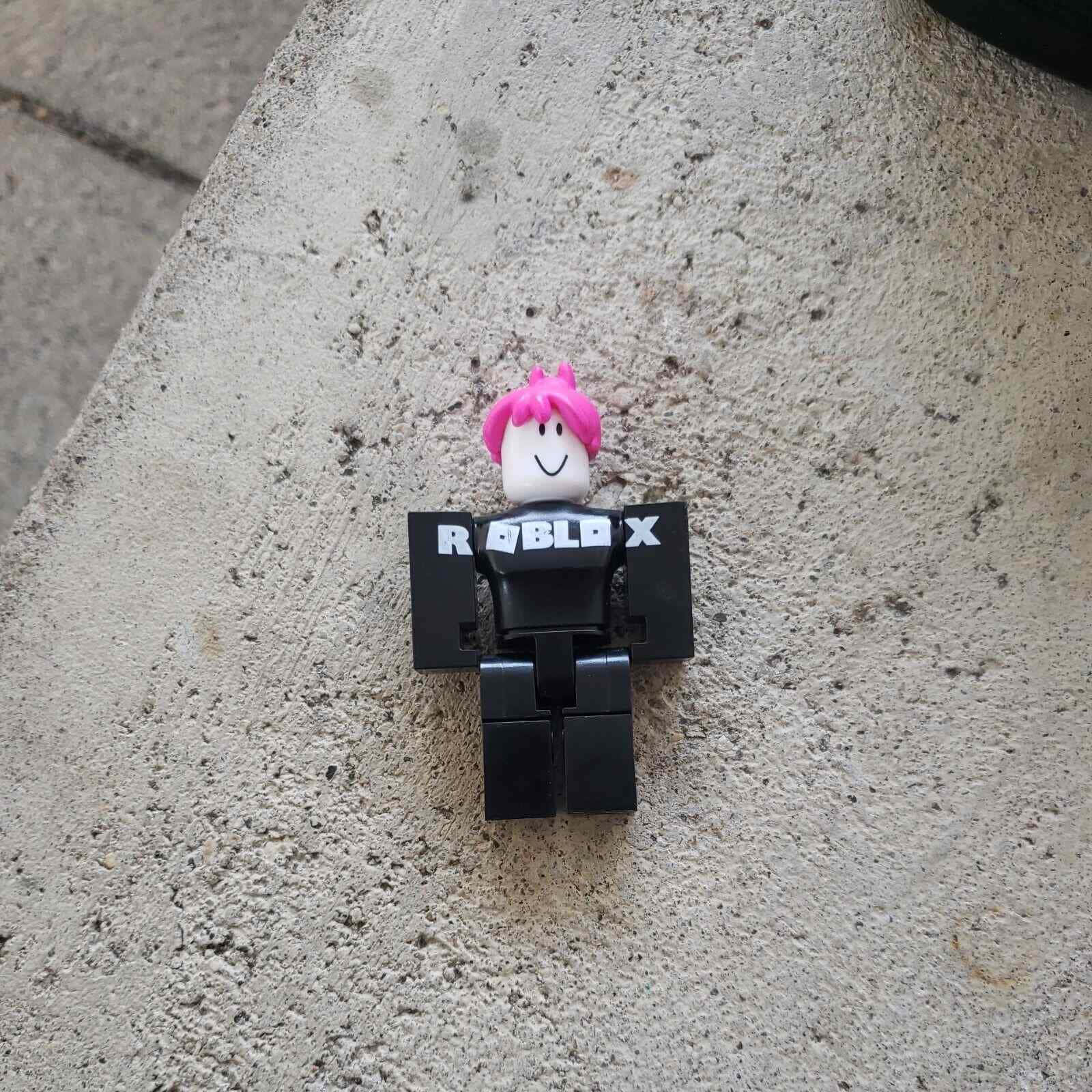 Roblox Figure Pink Hair Concrete Background Wallpaper