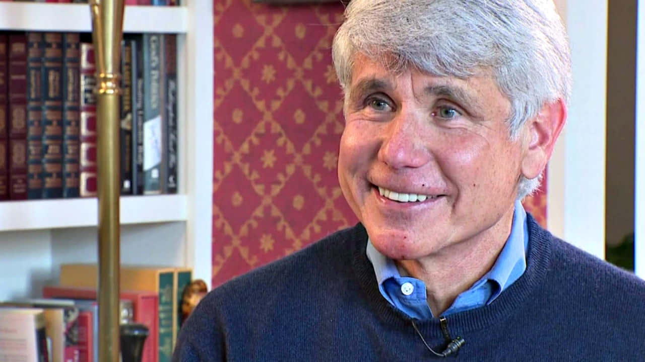 Rod Blagojevich Smiling In Home Library Wallpaper