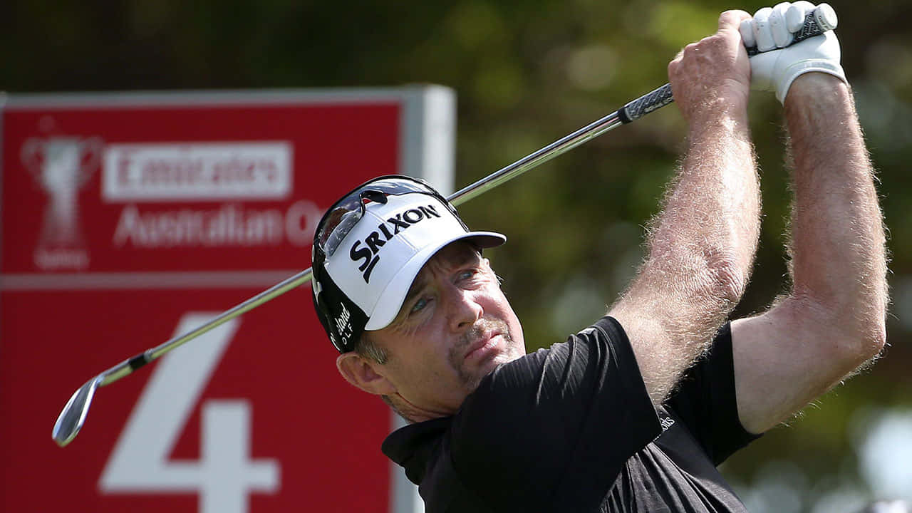 Rod Pampling In Mid-swing With His Golf Club Wallpaper