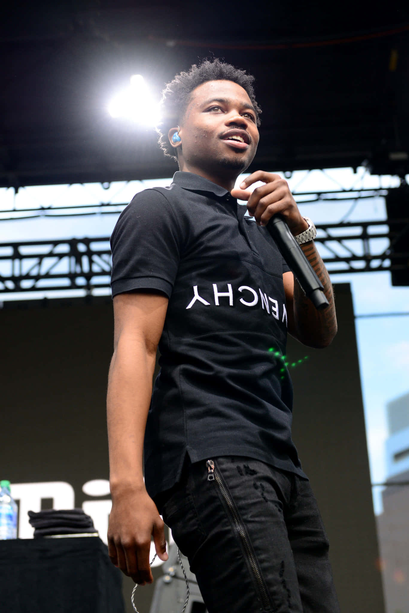 Roddy Ricch Performing Live On Stage Wallpaper