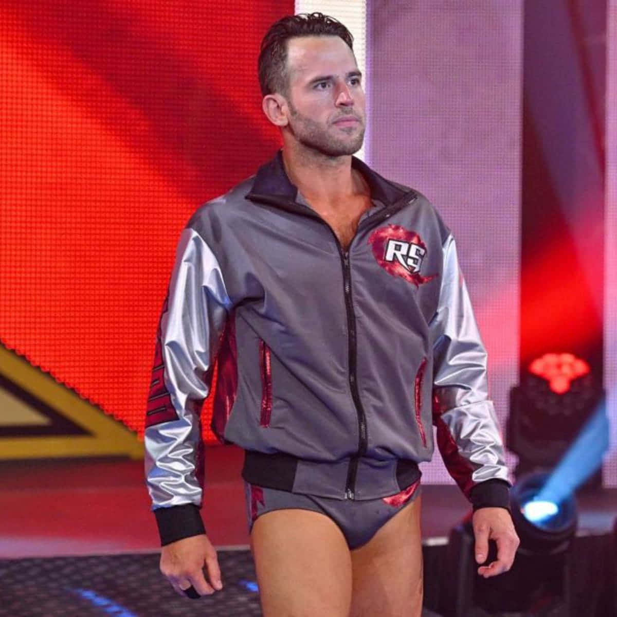 Roderick Strong, The Professional Wrestler, Posing Confidently In His Sports Jacket And Singlet Wallpaper