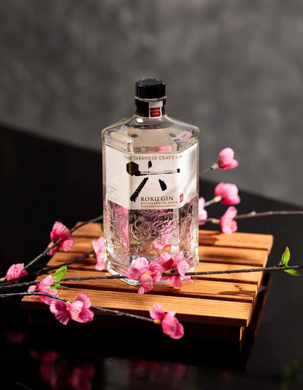 Roku Gin Bottlewith Cherry Blossoms Wallpaper