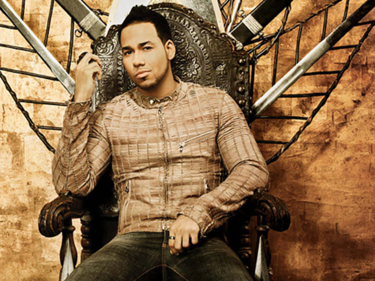 Romeo Santos Throne Pose Wallpaper