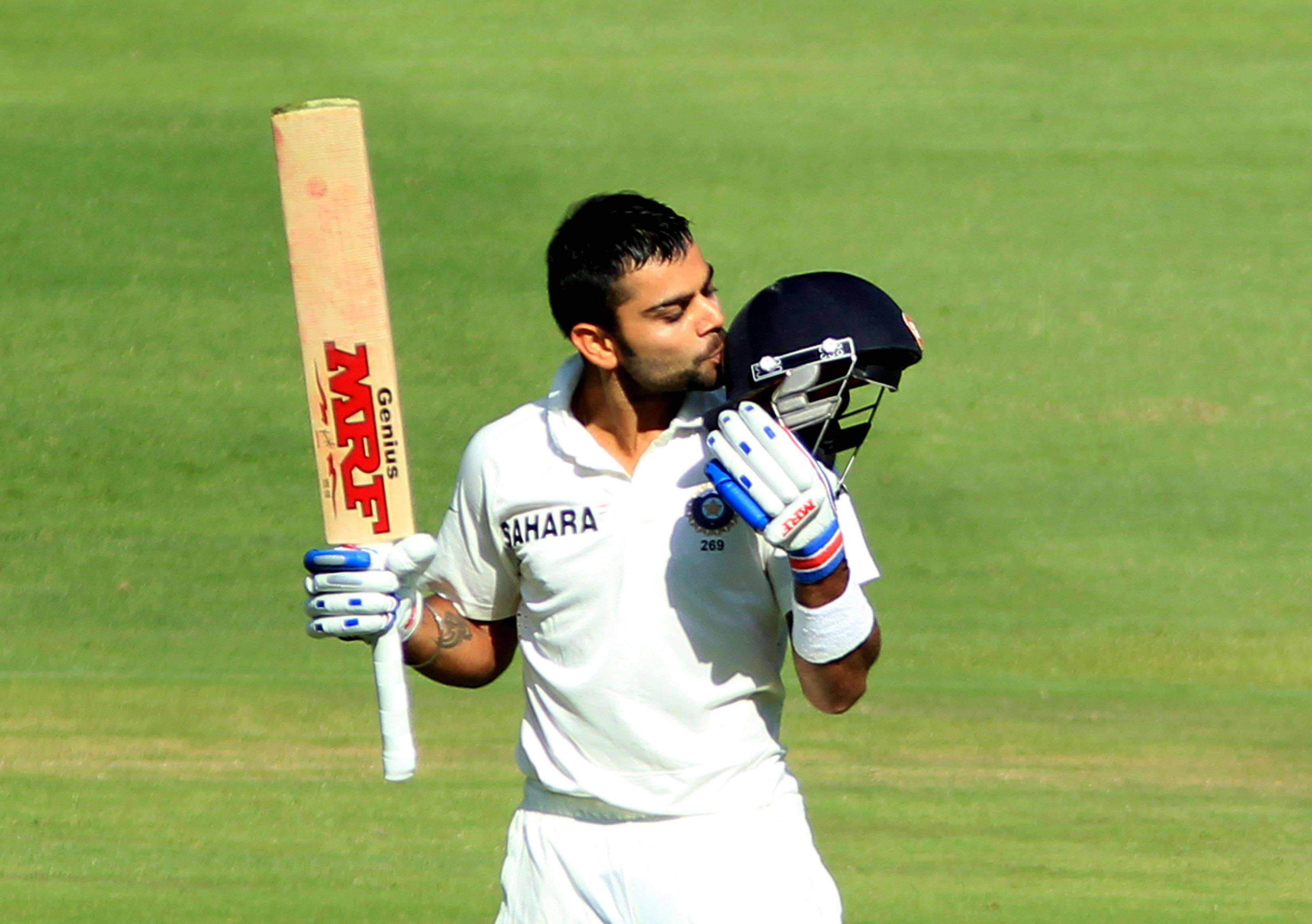 Royal Challengers Bangalore Captain Virat Kohli In Action During A Cricket Match Wallpaper