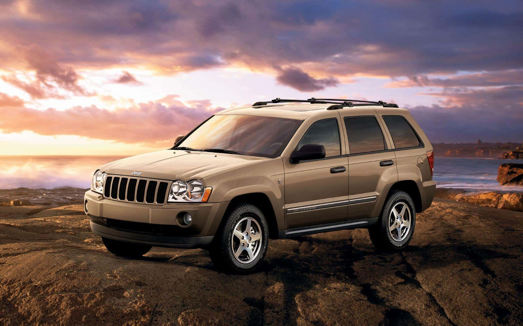 Rugged And Stylish Jeep Grand Cherokee In Nature Wallpaper