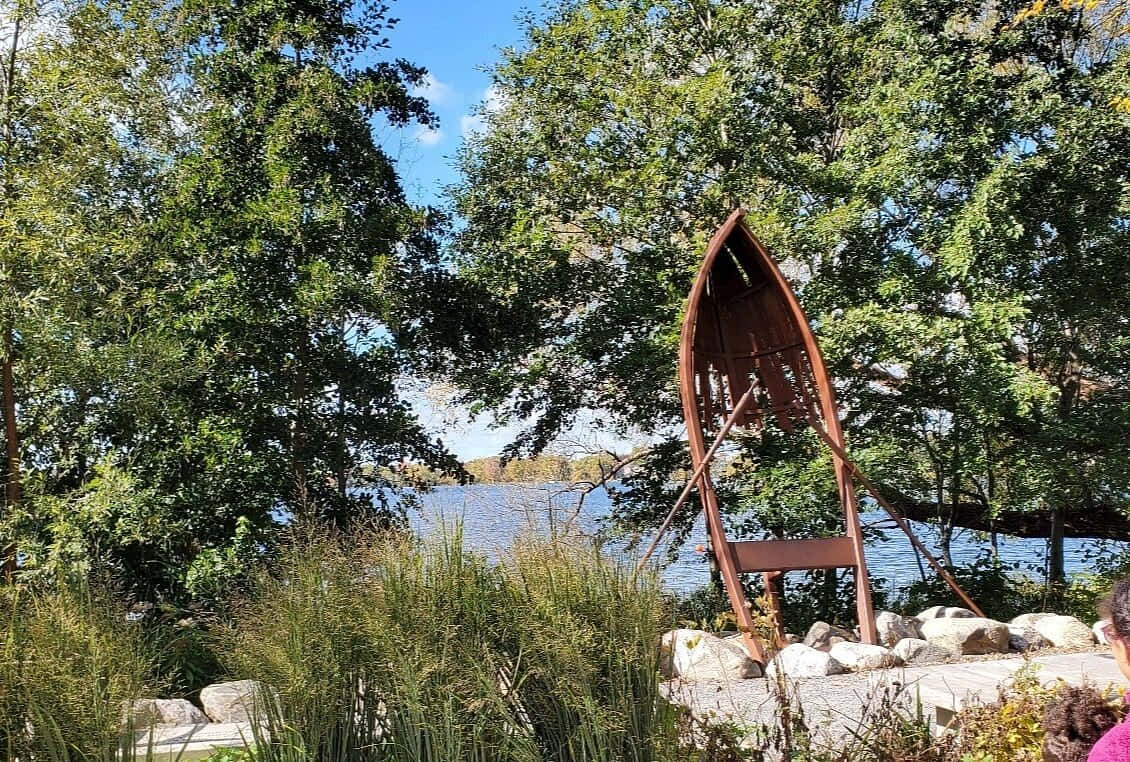 Rustic Boat Sculpture Lakeside Park Wallpaper