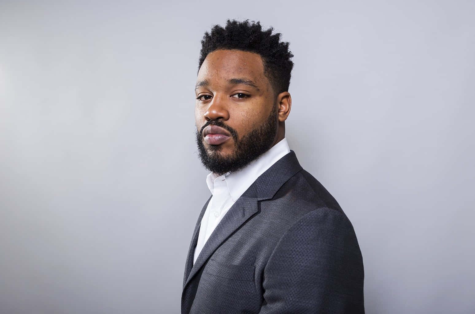 Ryan Coogler At A Prestigious Event Looking Confident And Stylish Wallpaper