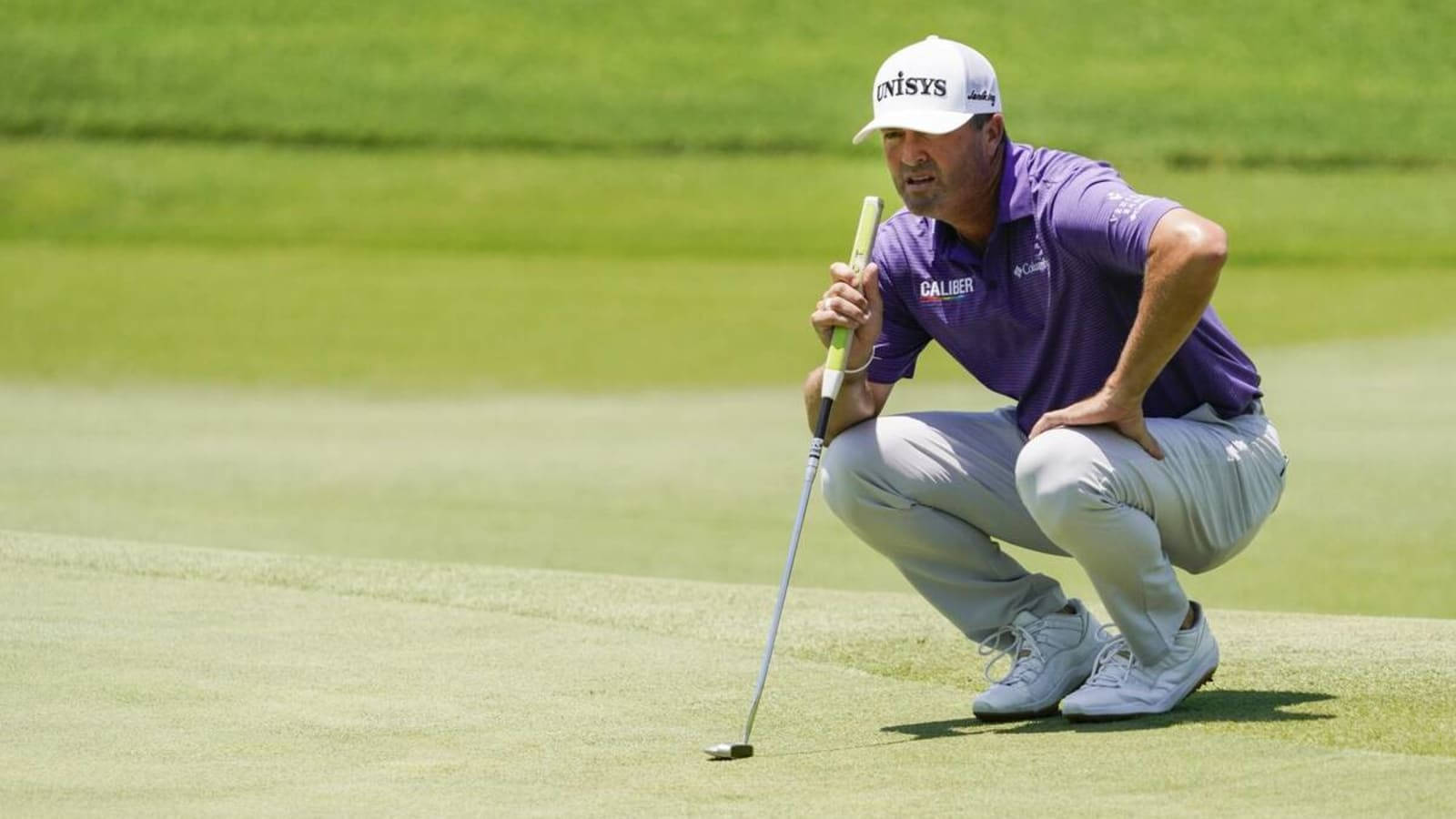 Ryan Palmer Squatting On Field Wallpaper