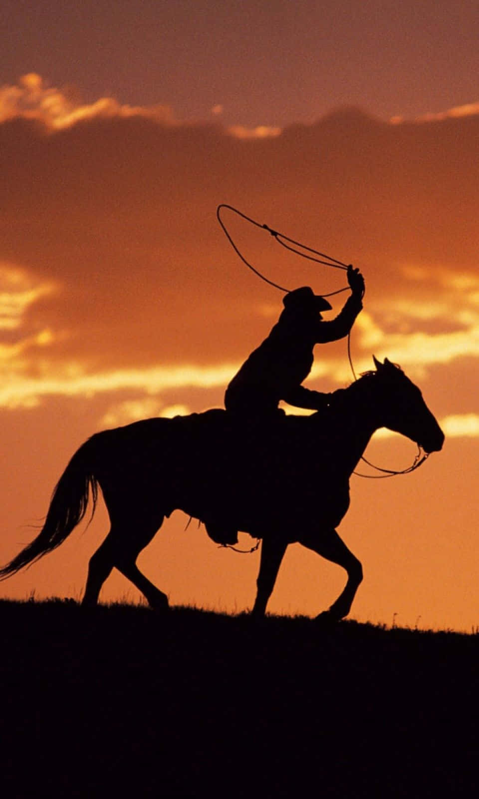 Saddle Up And Get Ready To Ride With This Cowboy Iphone Wallpaper. Wallpaper