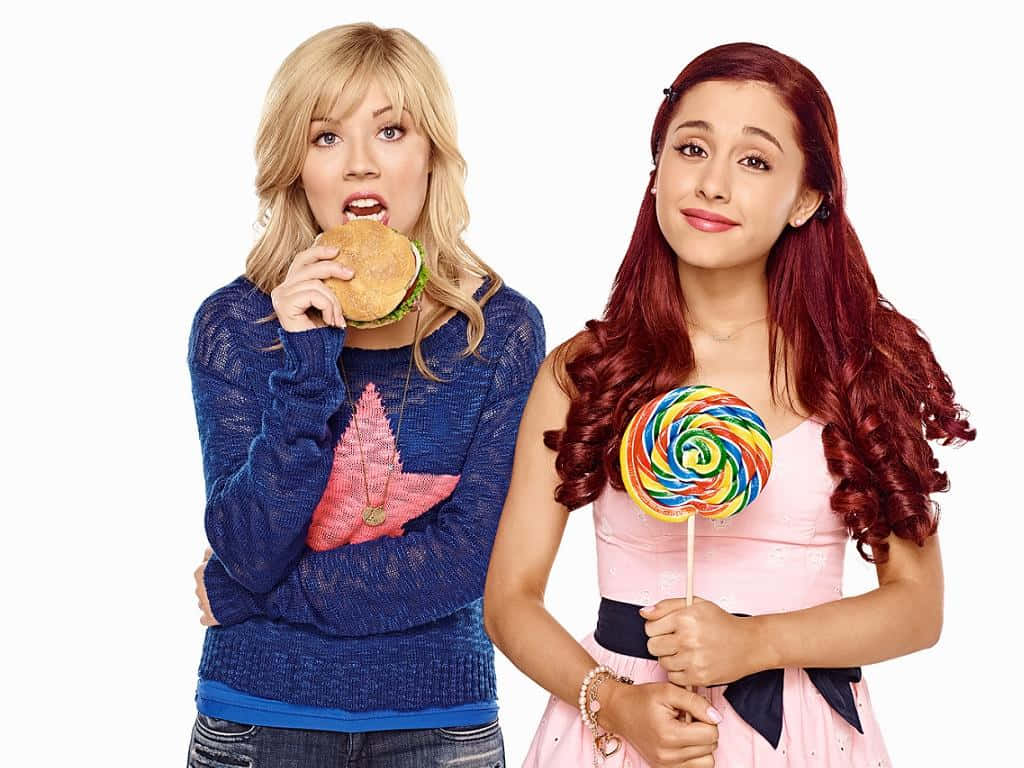 Sam And Cat Holding Lollipop Wallpaper