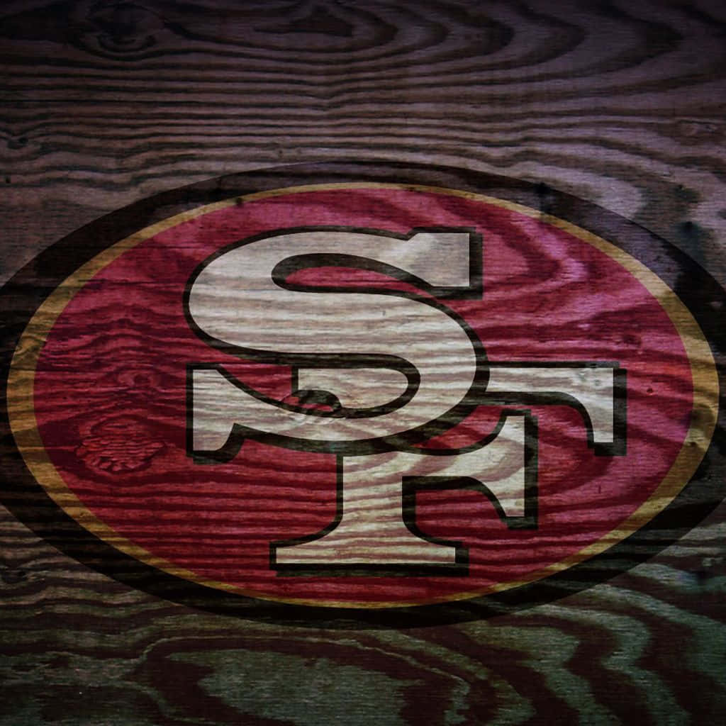 San Francisco 49ers Logo On A Wooden Background Wallpaper