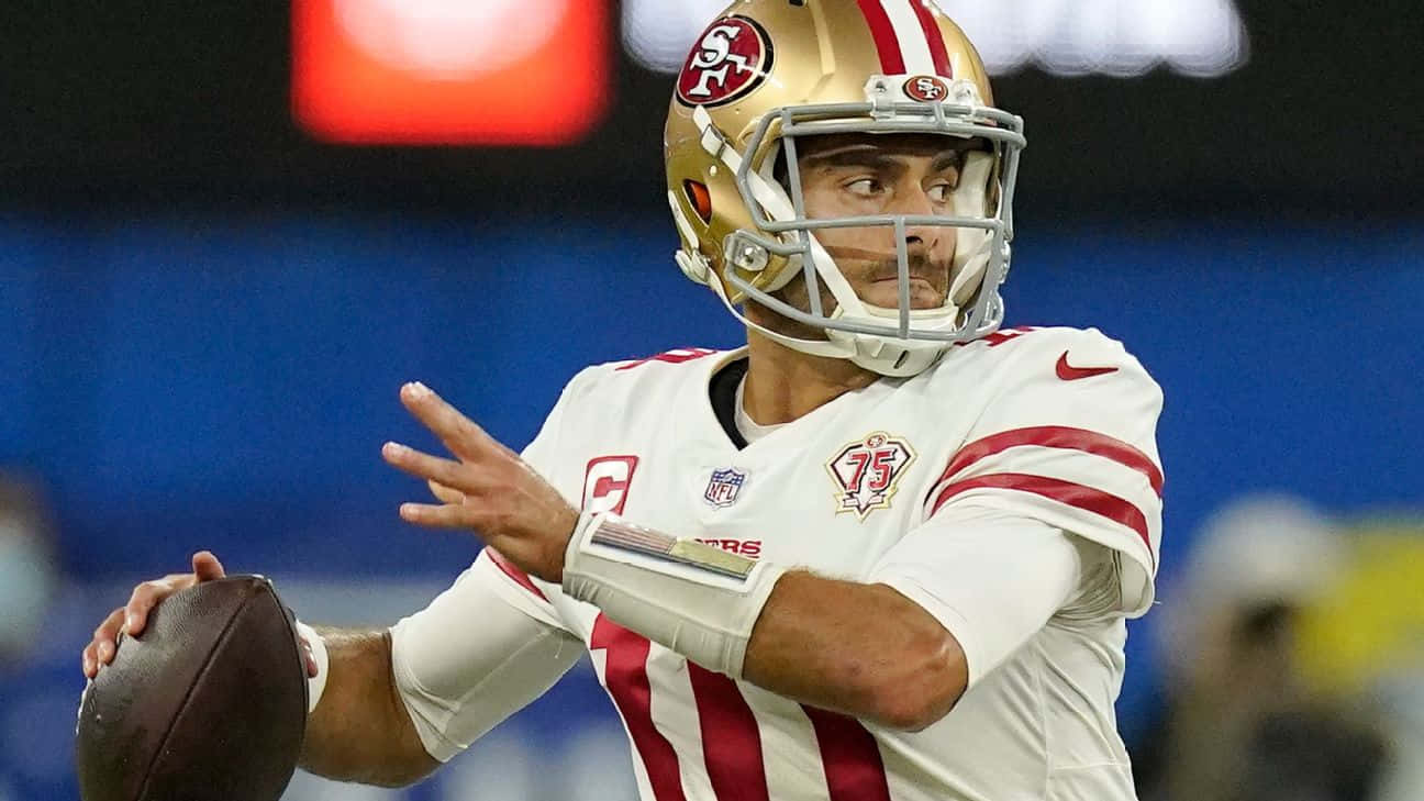 San Francisco 49ers Quarterback Jimmy Garoppolo In Action Wallpaper