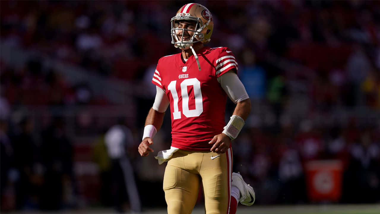 San Francisco 49ers Quarterback, Jimmy Garoppolo, In Action On The Field Wallpaper