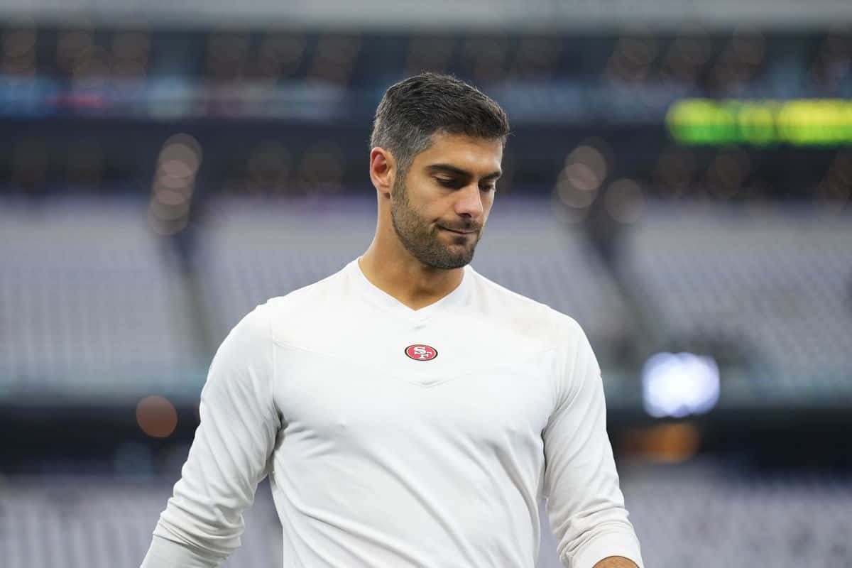 San Francisco 49ers Quarterback Jimmy Garoppolo In Action Wallpaper