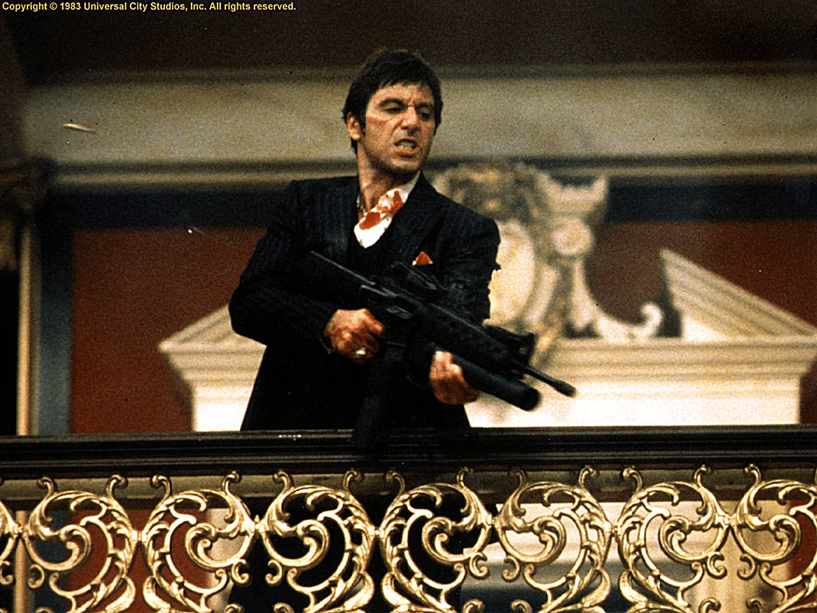 Scarface Holding A Gun Wallpaper