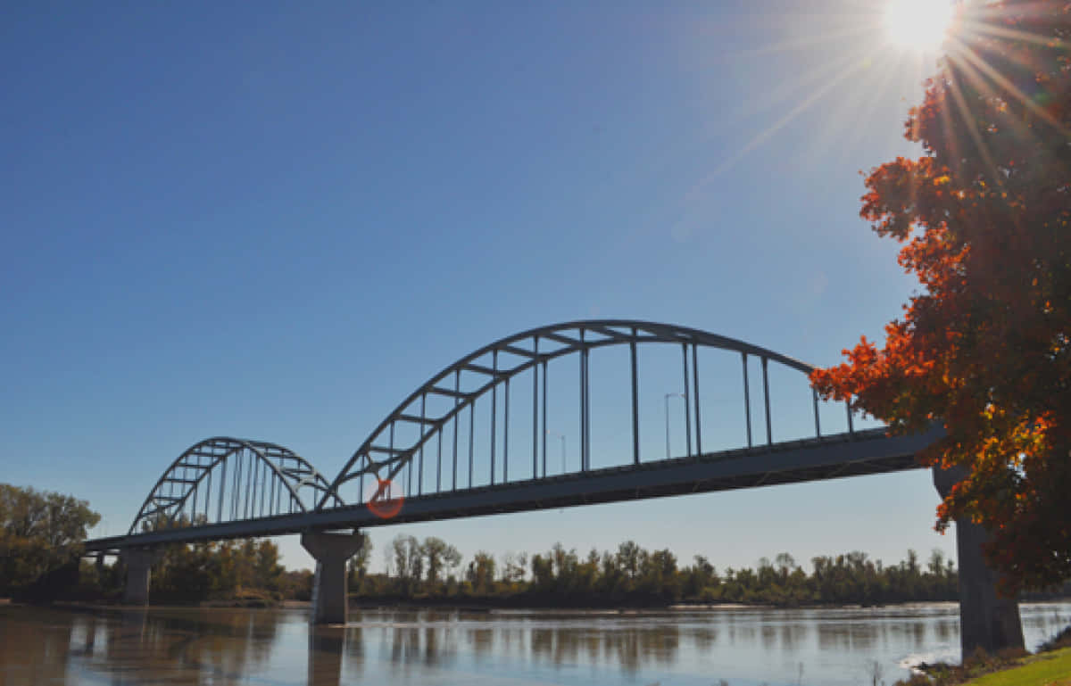 Scenic Autumn View Of A Wooden Bridge Wallpaper