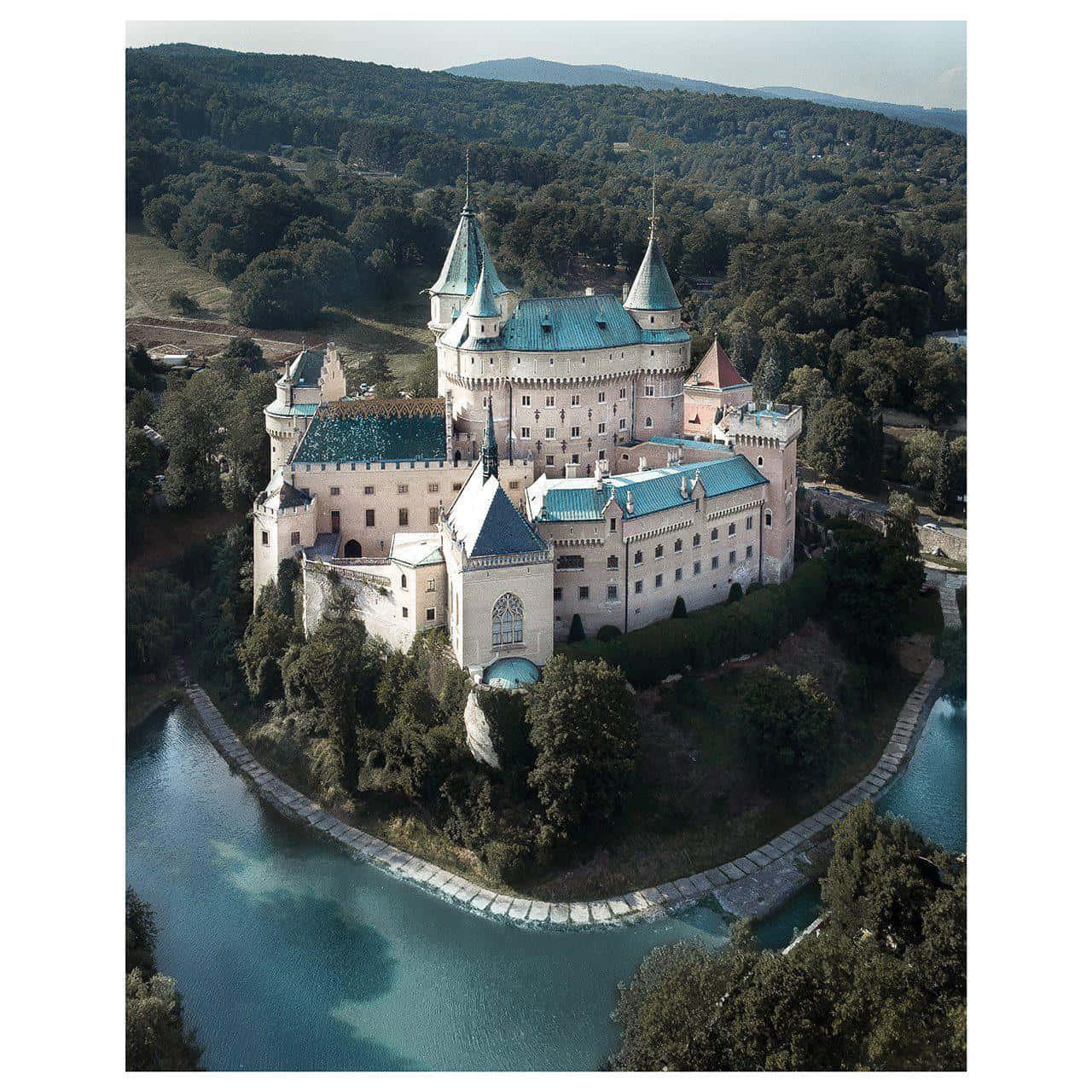 Scenic View Of Bojnice Castle Under Clear Blue Sky Wallpaper