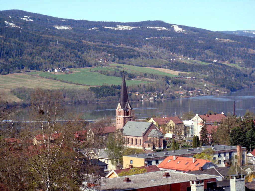 Scenic View Of Lillehammer City With A Beautiful Snowy Landscape. Wallpaper