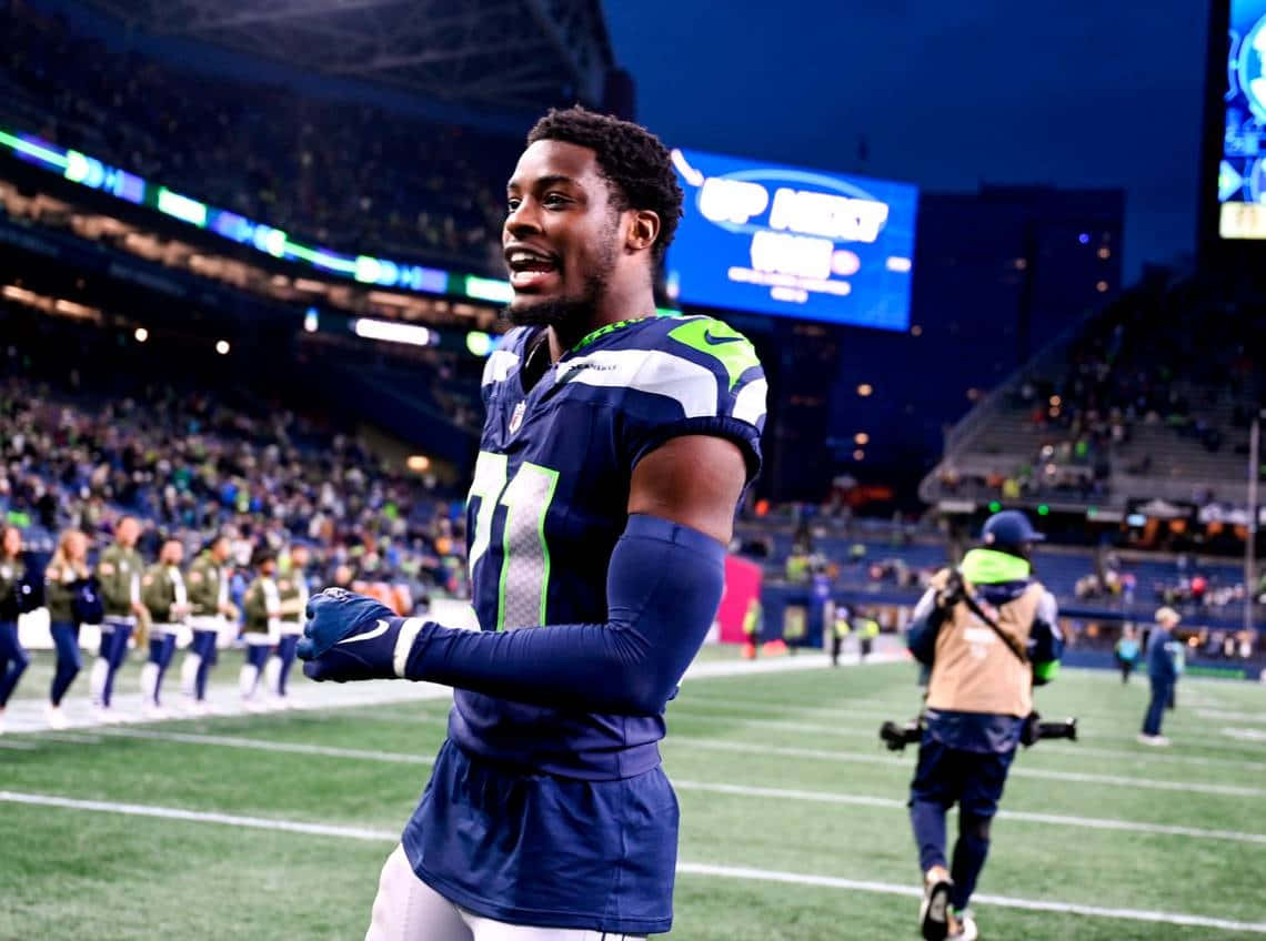 Seahawks Player Smilingon Field Wallpaper