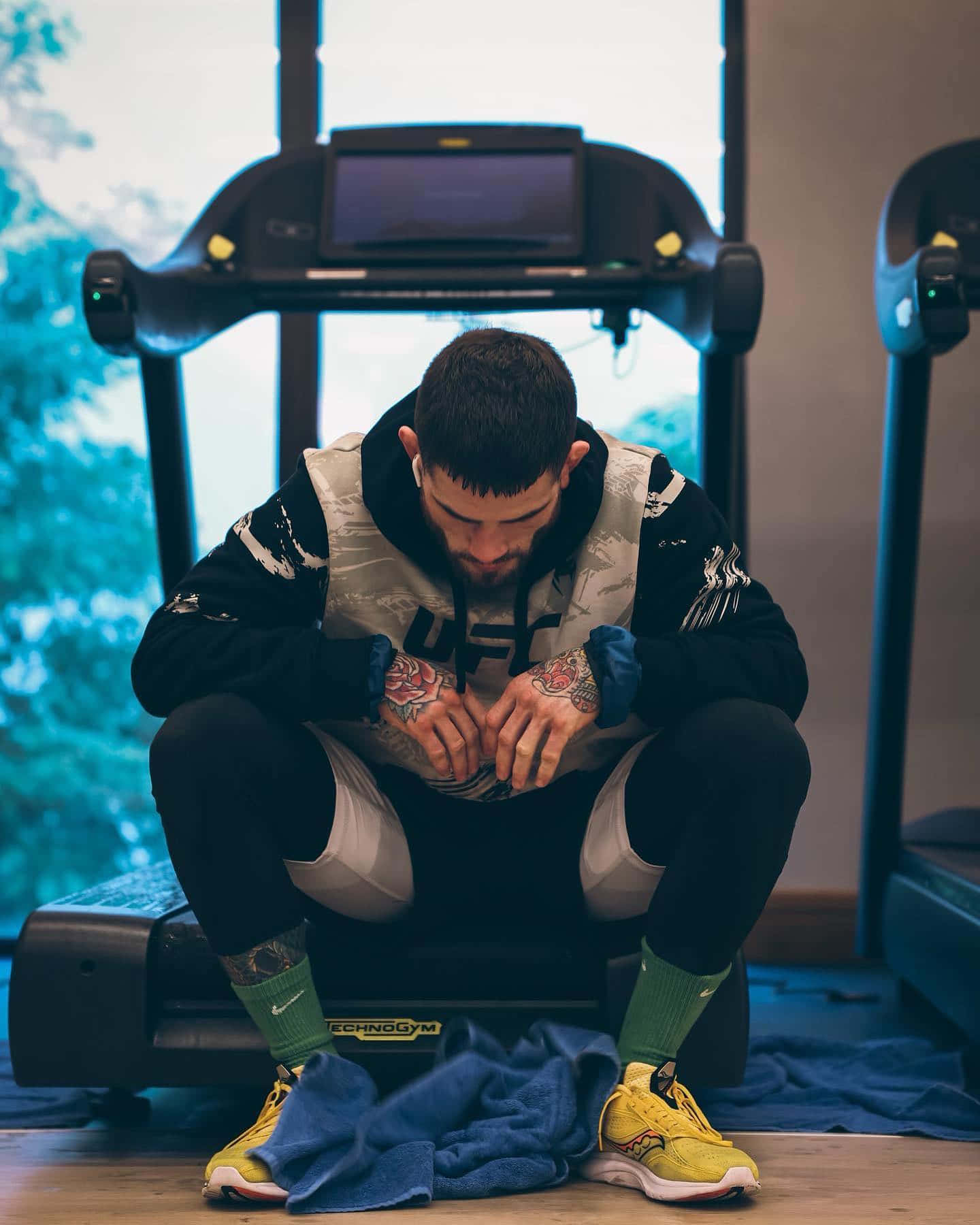 Sean Brady Sitting At Treadmill Wallpaper