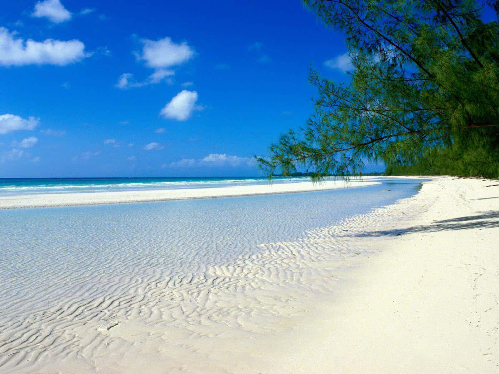 Serene Bahamas Beach At Sunset Wallpaper