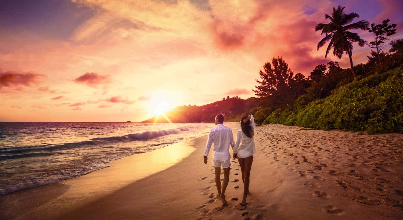 Serene Beach Walk At Sunset Wallpaper