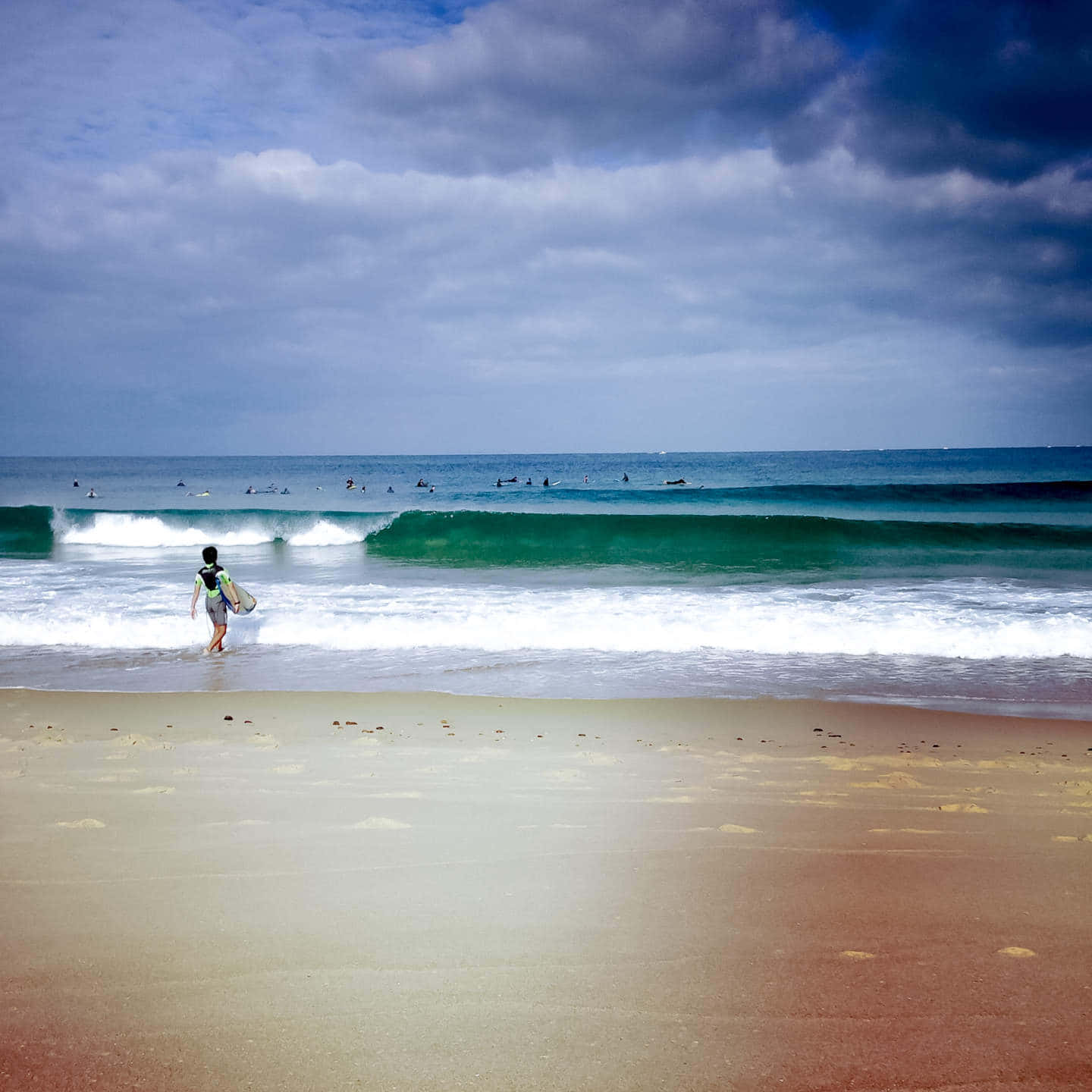 Serene French Beach With Golden Sunset Wallpaper