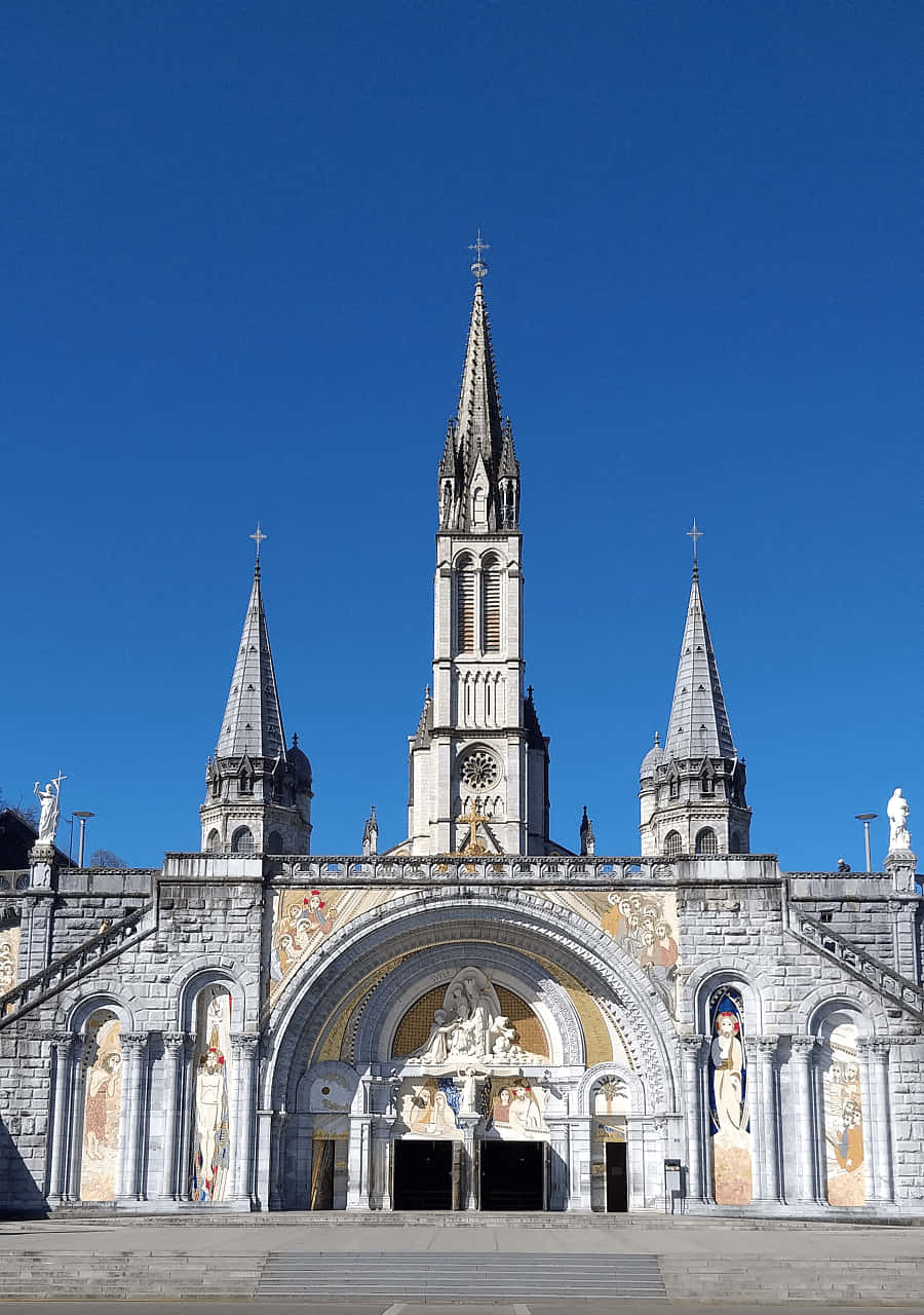 Serene Nightscape Of The Lourdes Sanctuary Wallpaper