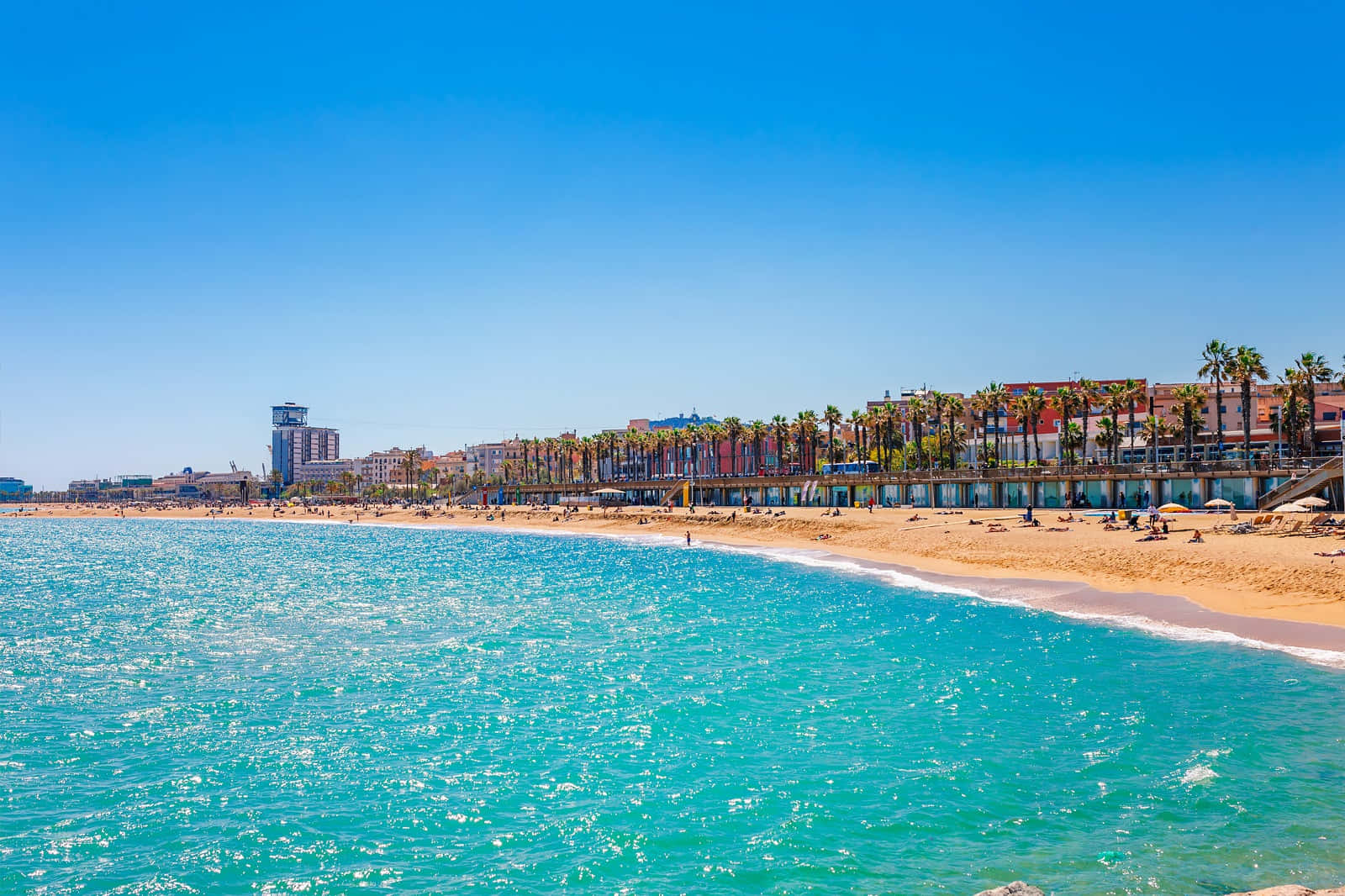 Serene Sunset At A Beautiful Spanish Beach Wallpaper