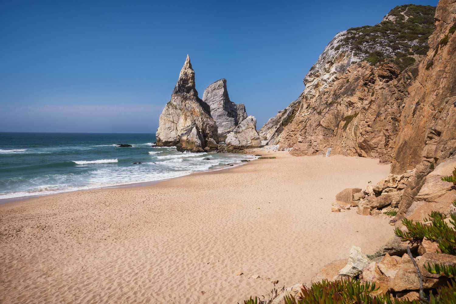 Serene Sunset At The Picturesque Portuguese Beach Wallpaper