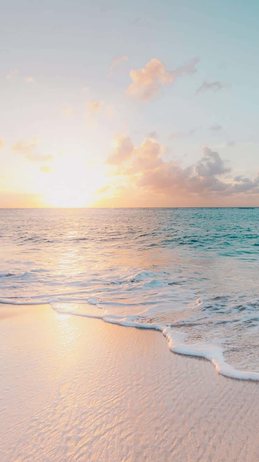 Serene_ Sunset_ Beach_ Scene.jpg Wallpaper