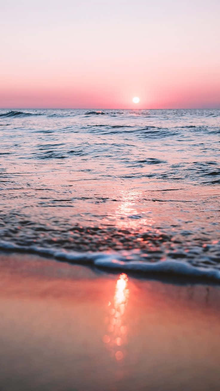 Serene Sunset Beachi Phone Wallpaper Wallpaper