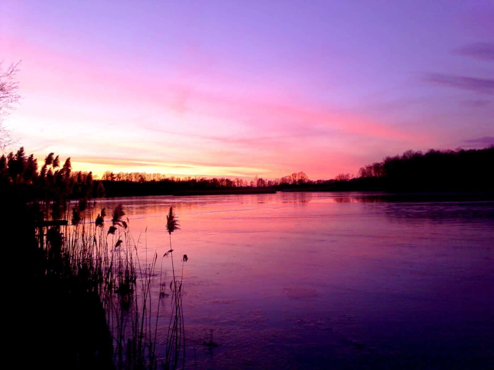 Serene Sunset Landscape With Pink Sky Wallpaper